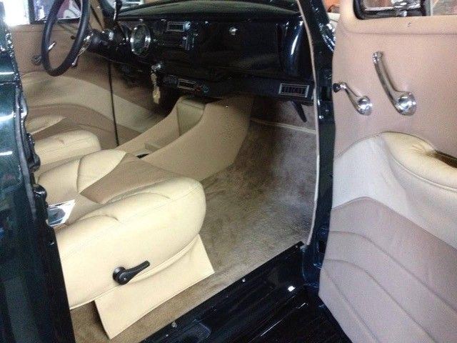 Tan bench seating and door cards, classic sedan