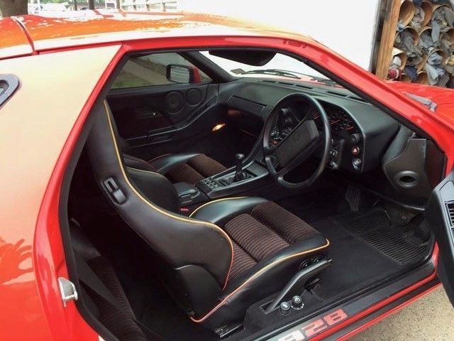 Modern sports car interior in red and black
