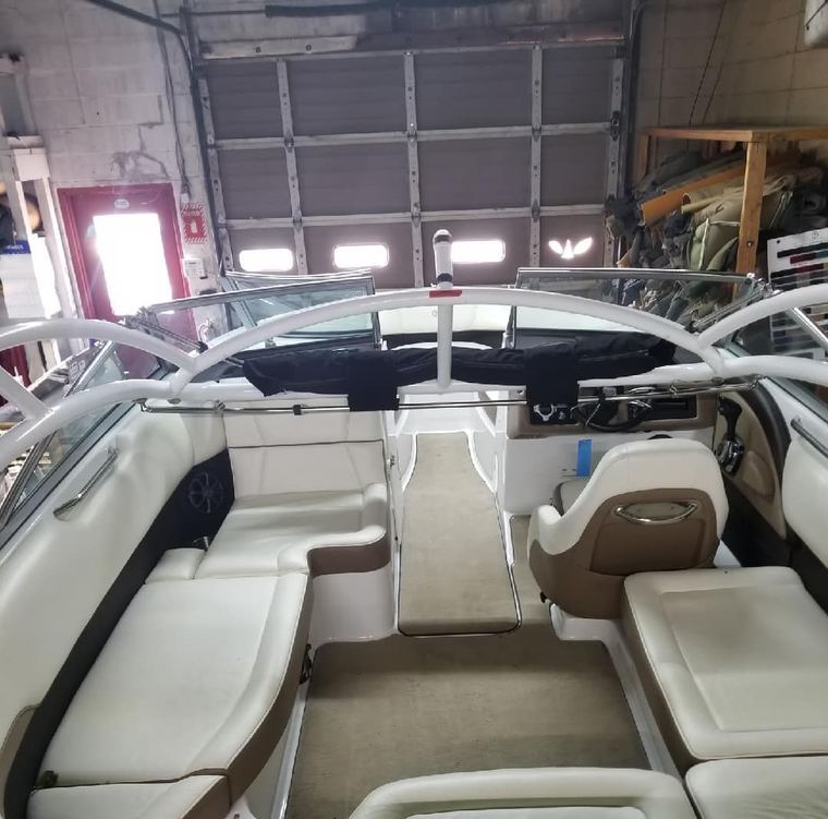 Boat cabin with helm seating and table