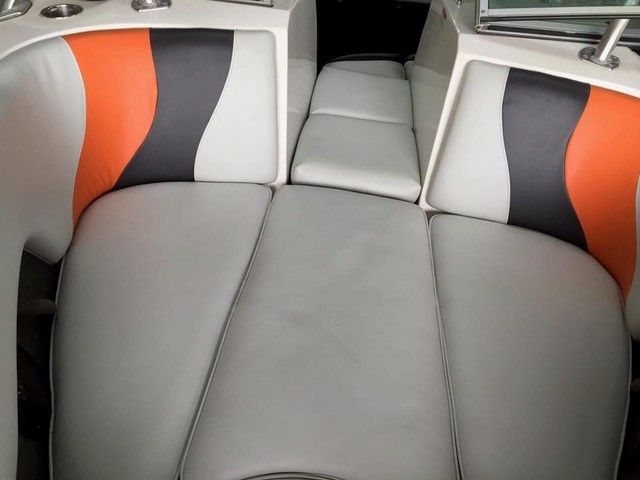 Boat seating reupholstered in orange, white and grey marine vinyl